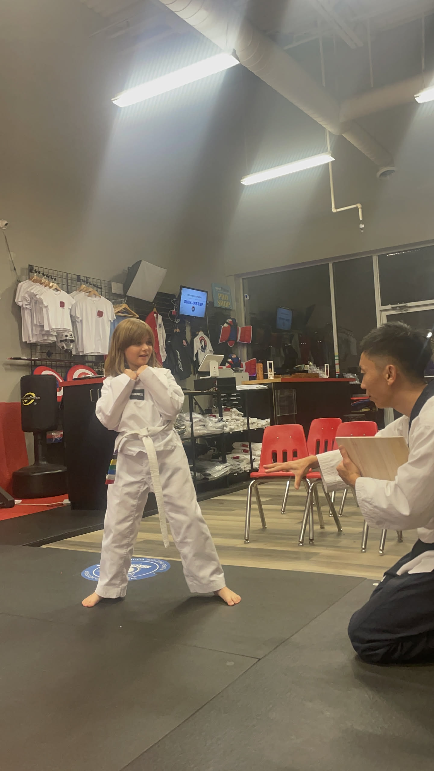 Master Jay So coaching a young student's stance during class at NEXTStep Martial Arts