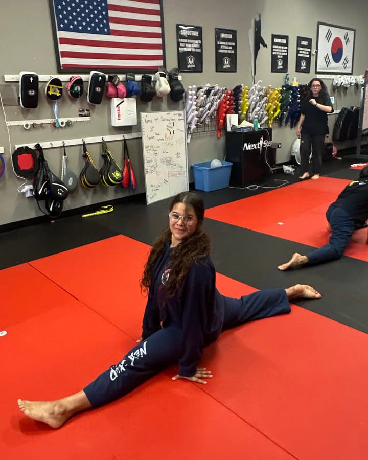 students stretching lines training room wide