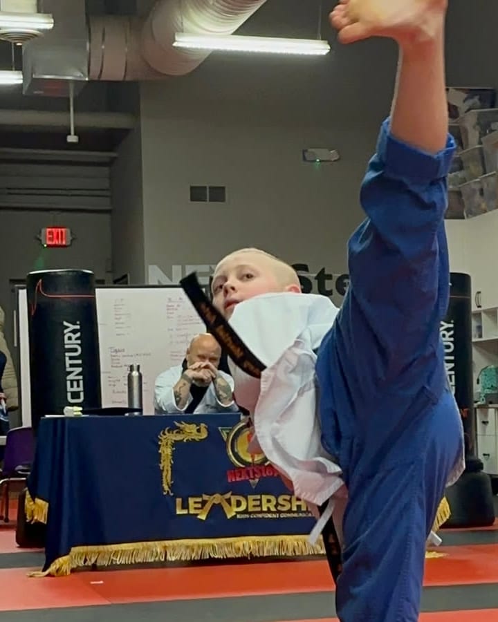 single student airborne taekwondo side kick